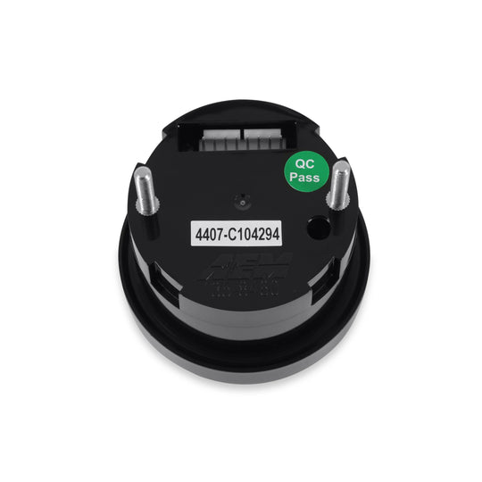 Black circular component with a green &