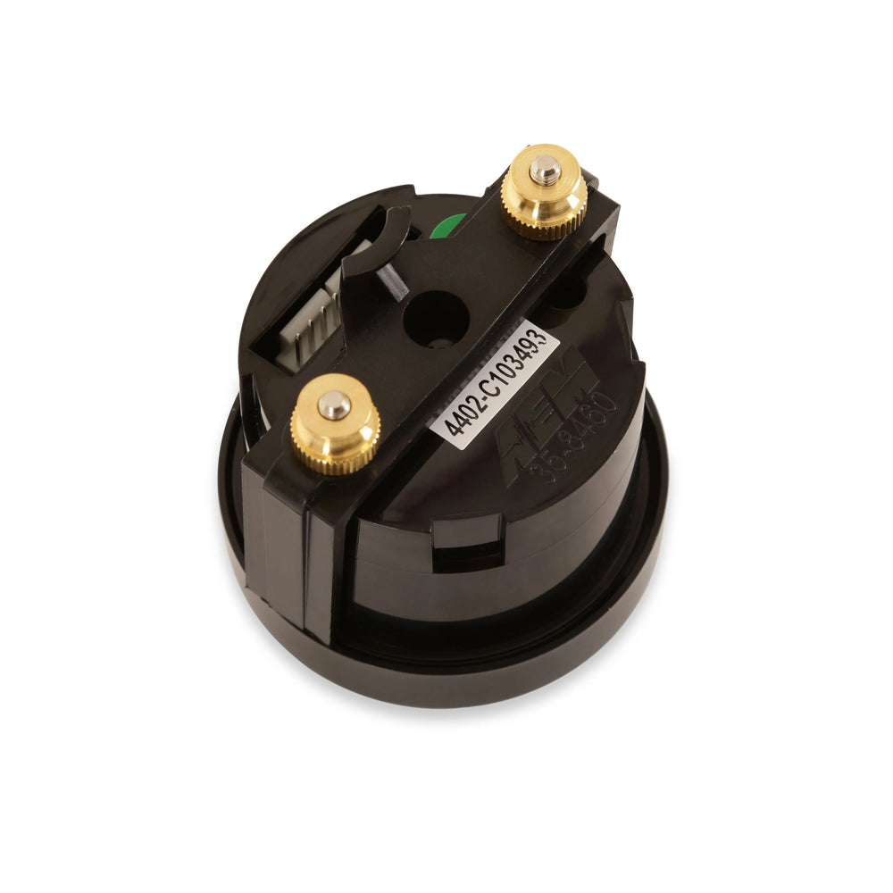 Black mechanical component with gold screws on a white background