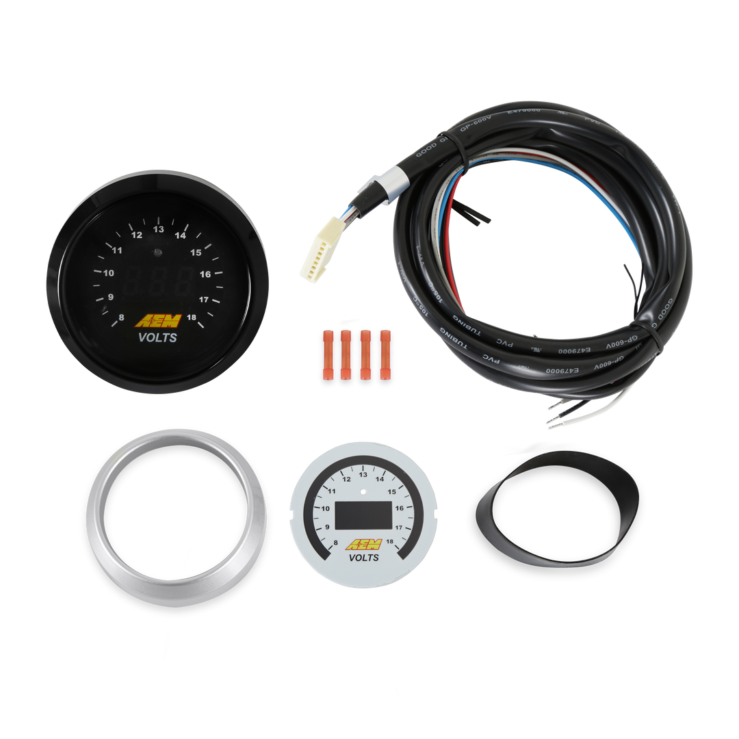 A 12V gauge kit with a black gauge face, silver bezel, white bezel, wiring harness, and mounting rings on a white background.