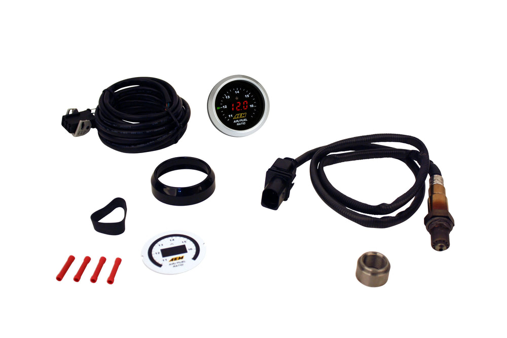 Collection of automotive gauges and accessories on a white background