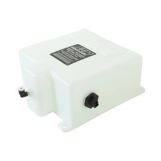White plastic tank with black connectors on a white background