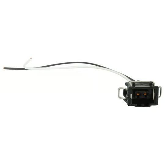 A small black electrical connector with two attached wires, one black and one white, photographed on a plain white background.