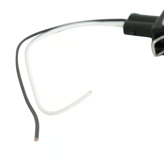 Close-up of a pair of eyeglasses arms showing white and black temple wires with copper-colored tips, connected to black plastic hinges on a white background.