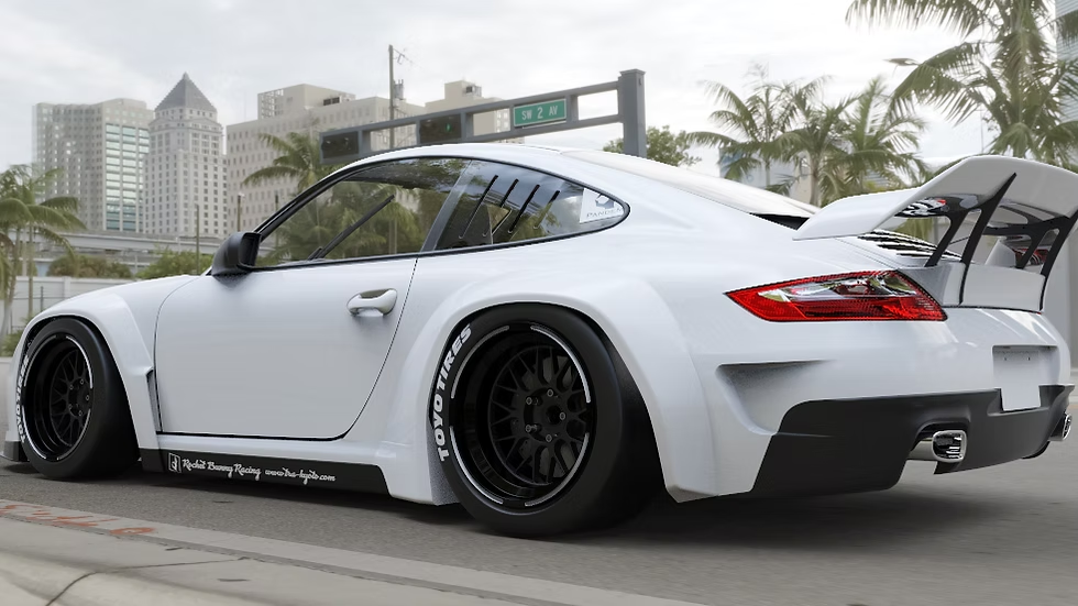 White sports car with black rims on a city street